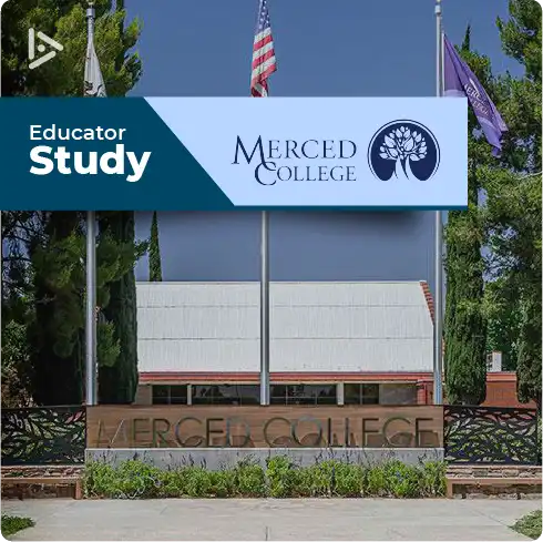 Three flags rise at the entrance to Merced College