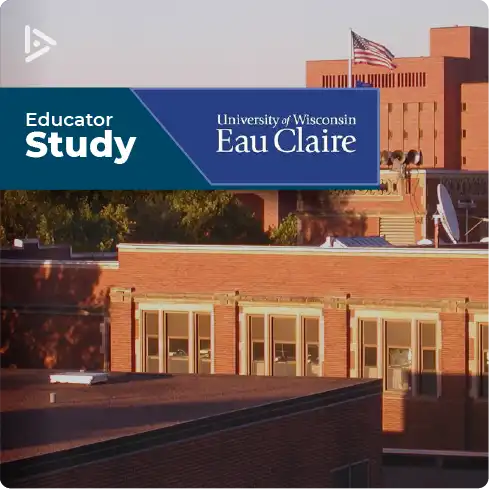 The sun sets on a rectangular campus of orange-hued brick